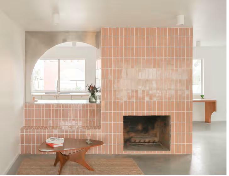 Pink-tiled fireplace and living room