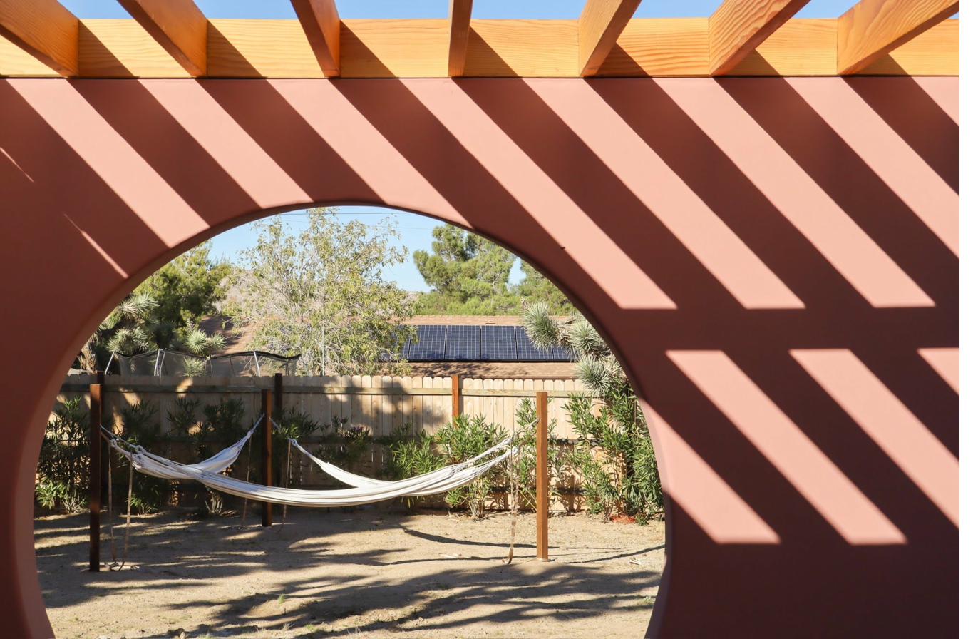 Hammock framed by the blush circle portal wall